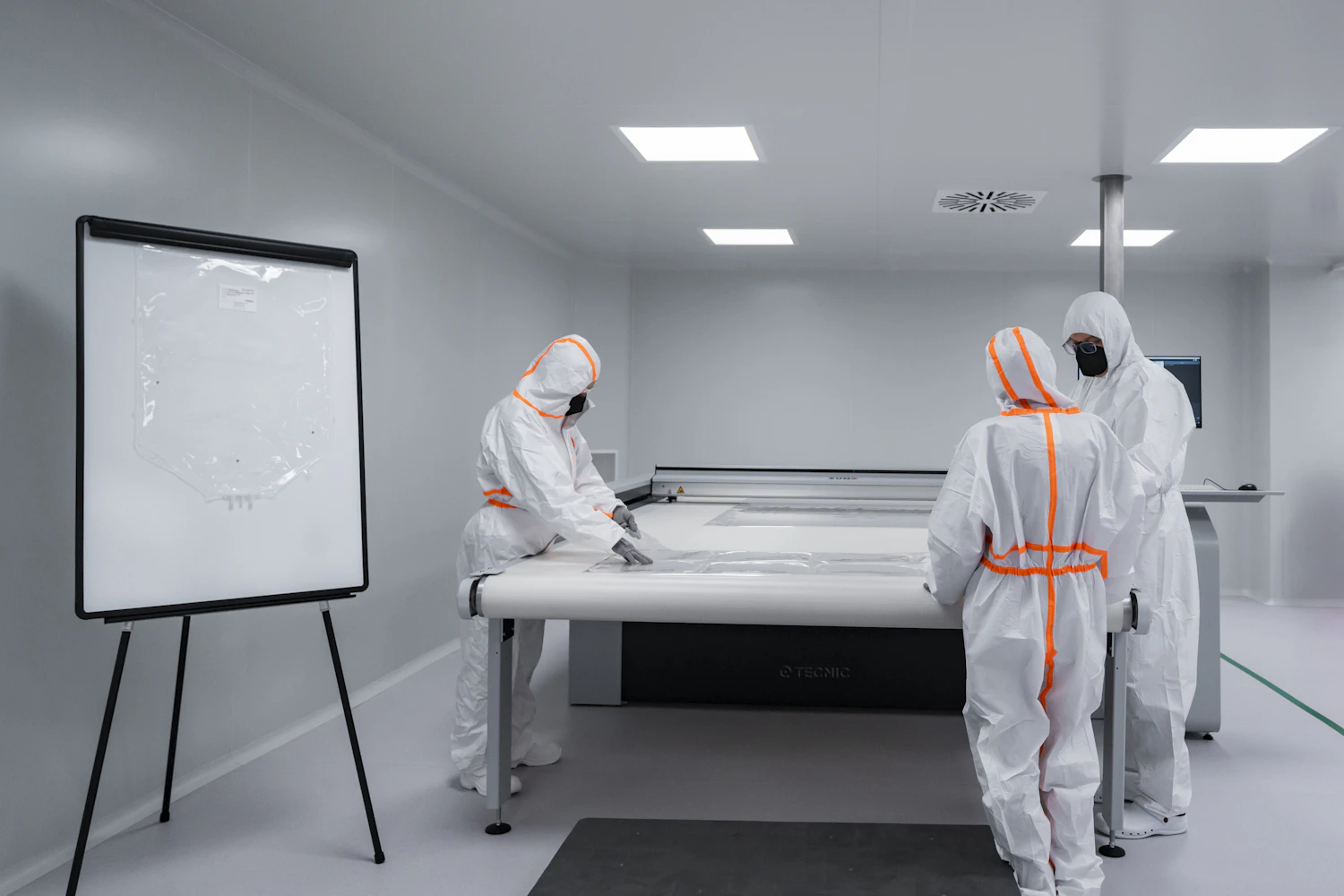 Laboratory workers coordinating in a cleanroom